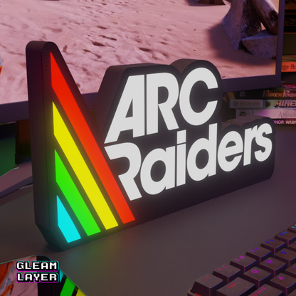 Glowing 'Arc Raiders' sign with rainbow colors on a desk.