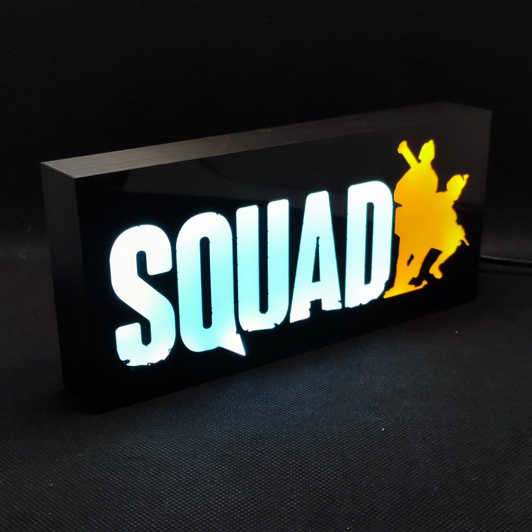 An illuminated SQUAD military combat game LED RGB light sign shown from the front, perfect for military gaming setup and room decor.