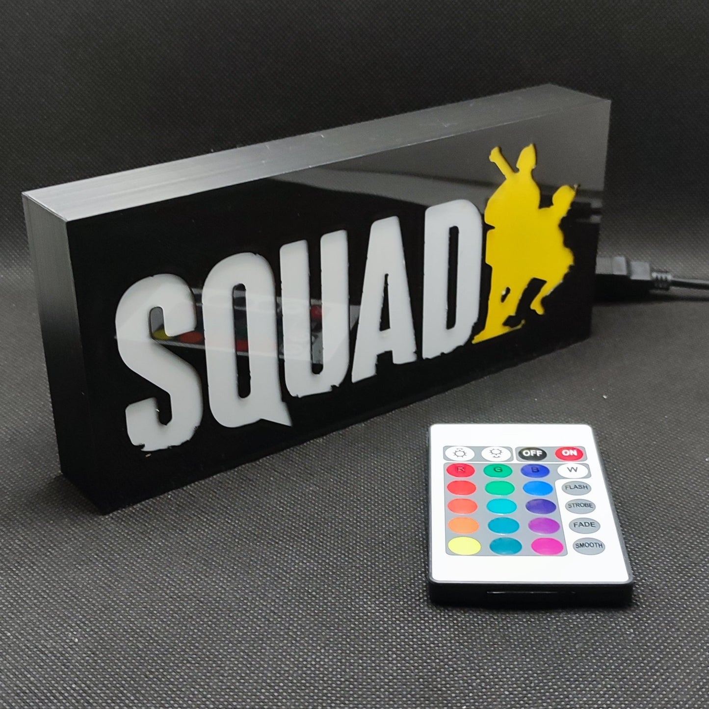 A left side view of the SQUAD military combat game LED RGB light sign highlighting its build quality, ideal for tactical gaming room decoration.